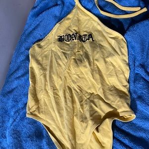 Yellow leotard with button closure